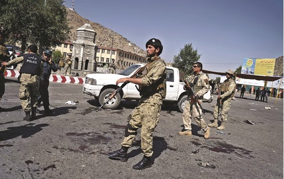 Afghan security personnel arrive after a suicide attack that targeted crowds of minority Hazaras during a demonstration at the Deh Mazang Circle of Kabul yesterday.