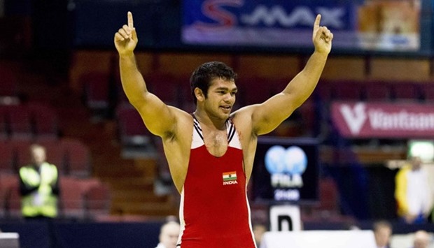 India's Narsingh Pancham Yadav celebrates after winning the men's 74kg wrestling freestyle weight class during the Vantaa Cup 2012 Olympic qualifying tournamentu2019s finals in Vantaa on May 4, 2012.