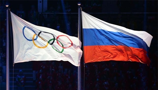 The Olympic and Russian flags are pictured during the opening ceremony of the Sochi Winter Olympics in this file photo.