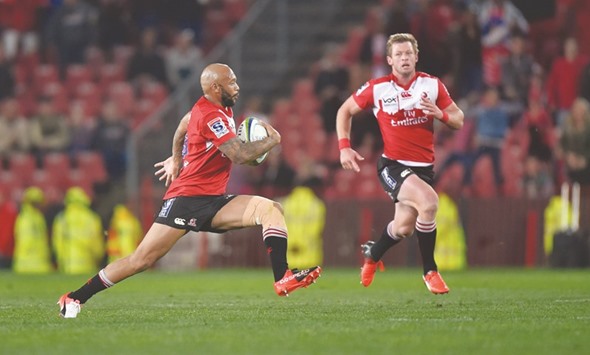 Lionel Mapoe and Ruan Combrinck of the Emirates Lions run during their Super Rugby quarter-final clash against the Crusaders at Ellis Park rugby stadium in Johannesburg.
