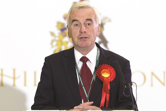 In a picture taken on May 8, 2015, Labour MP for Hayes and Harlington, John McDonnell, gives a speech on stage after after winning his seat in Uxbridge, west London, after votes have been counted in the British general election. The head of economic policy under Britainu2019s new opposition Labour party leader Jeremy Corbyn apologised on Thursday for once calling for Irish Republican Army (IRA) members to be u201chonouredu201d.