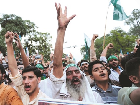 Supporters of the political and religious party Jamau2019at-e-Islami shout slogans during a rally in Islamabad condemning the violence in Kashmir.