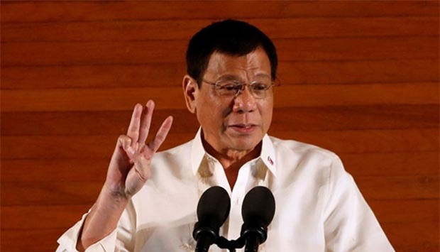 Philippine President Rodrigo Duterte gestures during his first State of the Nation Address at the Philippine Congress in Quezon city, Metro Manila, on Monday.