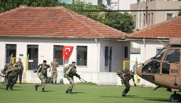 Turkish commandos take part in an operation to search for missing military personnel suspected of being involved in the coup attempt, in Marmaris, Turkey, July 22, 2016
