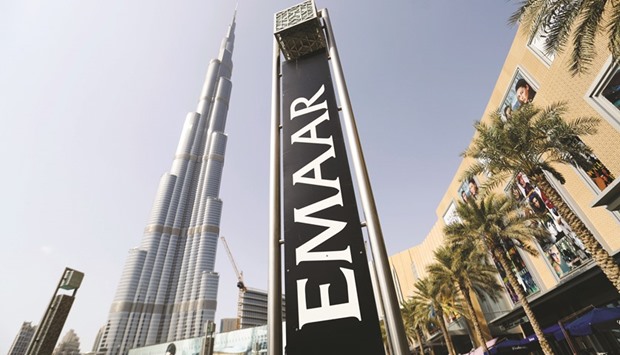 An Emaar Properties sign stands near the Burj Khalifa tower in Dubai. Emaar Properties jumped 2.2% to Dh7.00 yesterday, retesting major technical resistance on its October peak of Dh7.01.