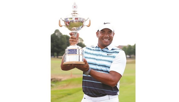 Jhonattan Vegas of Venezuela poses with the trophy after winning the Canadian Open at in Oakville, Canada.