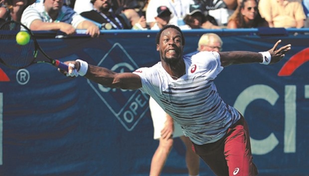 Gael Monfils of France returns a shot during his 5-7, 7-6, 6-4 win over Ivo Karlovic of Croatia in the final of the Citi Open at Rock Creek Tennis Center in Washington.