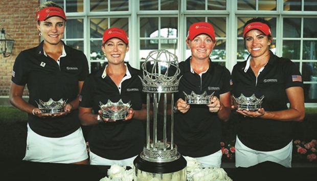 Lexi Thompson (from left), Cristie Kerr, Stacy Lewis and Gerina Piller of the United States pose with the trophy after winning the 2016 UL International Crown Champions at the Merit Club in Chicago, Illinois, on Sunday.