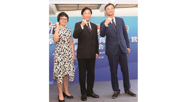 (L to R) Managing director of YunFeng Capital Xia Xiaoyan, AIBA president Ching Kuo-Wu and CEO of Alisports Zhang Dazhong pose during a press conference in Shanghai yesterday.