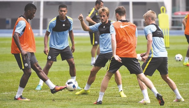 Manchester City players during a training session ahead of their International Champions Cup match against Manchester United in Beijing. The pre-season derby was cancelled just hours before kick-off yesterday.
