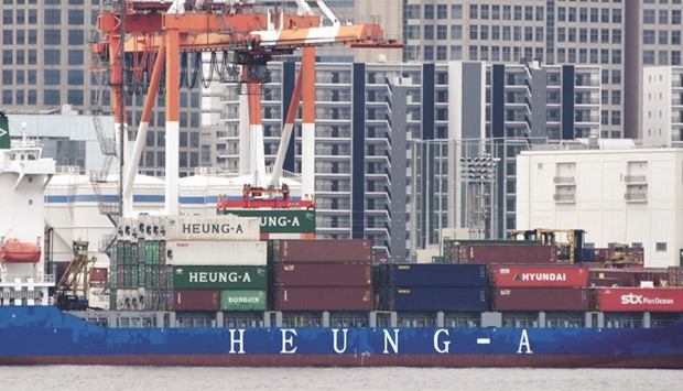 A container is transferred from a freighter at a port in Tokyo. Japanu2019s trade balance in June hit a surplus of u00a5692.8bn versus a u00a5494.8bn surplus seen in a Reuters poll of economists.