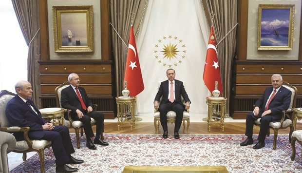 Turkeyu2019s Nationalist Movement Party (MHP) chairman Devlet Bahceli,  Republican Peopleu2019s Party chairman Kemal Kilicdaroglu, President Recep Tayyip Erdogan and  ruling Justice and Development Party (AK Party) chairman Binali Yildirim  during a meeting at the Presidential Complex in Ankara yesterday.