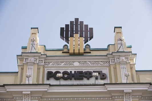 A logo is displayed above the headquarters of Rosneft in Moscow. The government has said it plans to sell part or all of its stake in Bashneft this year and is also weighing a sale of Rosneft as it disposes of assets to help plug a deficit after the collapse in crude prices sapped revenue.
