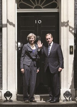 Prime Minister Theresa May poses for the media with Irelandu2019s Taoiseach Enda Kenny in Downing Street in London yesterday.