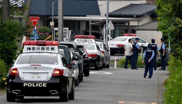 Police stand guard near the Tsukui Yamayuri En care centre where a knife-wielding man went on a rampage in Sagamihara, southwest of Tokyo, on Tuesday.