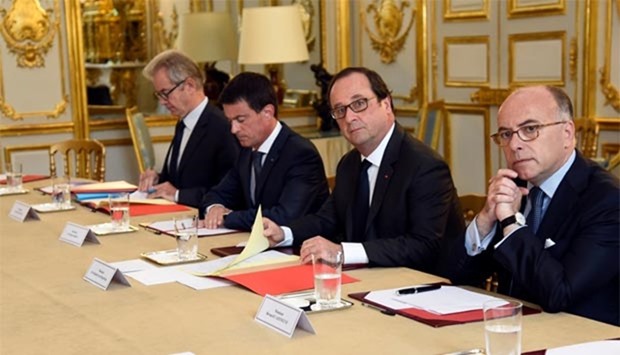 French President Francois Hollande, Interior Minister Bernard Cazeneuve and Prime Minister Manuel Valls attend a meeting with representatives of religious communities at the Elysee Palace in Paris on Wednesday.
