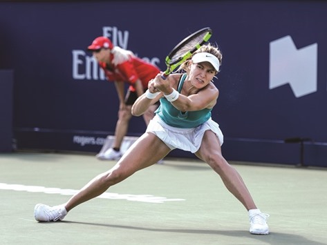Eugenie Bouchard of Canada hits a return during her match against Lucie Safarova of Czech Republic at the Montreal WTA tournament on Tuesday. Bouchard won 3-6, 6-3, 6-7. (AFP)