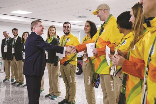 IOC president Thomas Bach is welcomed by volunteers on his arrival for Rio 2016 Olympic games at Antonio Carlos Jobim (Galeao) International Airport in Rio de Janeiro yesterday. (Reuters)