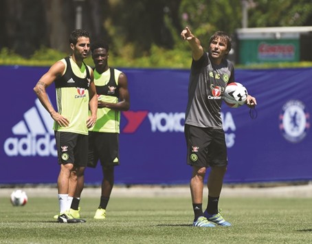 New Chelsea coach Antonio Conte (R) gestures during a training session before their International Champions Cup.