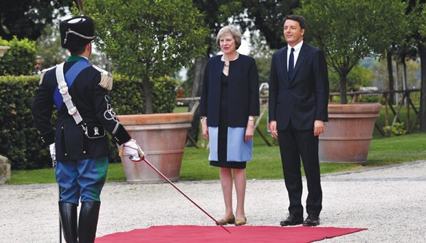 Italian Prime Minister Matteo Renzi with his British counterpart, Theresa May, at the Villa Doria Pamphili prior to a meeting in Rome yesterday.