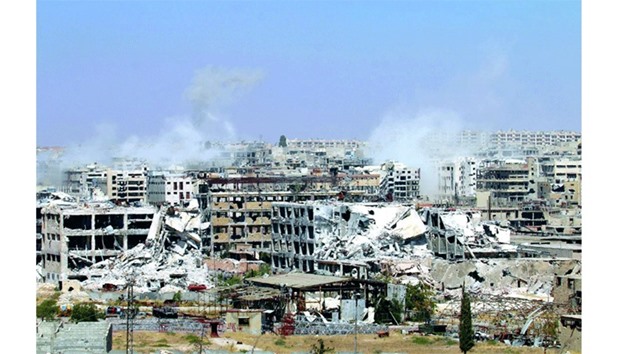 Smoke billows from buildings during an operation by Syrian government forces to retake control of the rebel-held district of Leramun, on the northwest outskirts of Aleppo, on Tuesday.