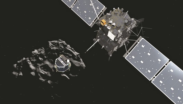 This handout artistu2019s impression released on November 12, 2014 by the ESA shows Philae separating from its mother ship Rosetta and descending to the surface of comet 67P/Churyumov-Gerasimenko. Ground controllers bid a final farewell yesterday Philae, cutting communications after a year-long silence with the tiny probe hurtling through space on the surface of a comet.