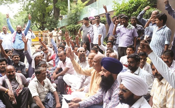 Auto-rickshaw and taxi union workers stage a protest near Delhi Chief Minister Arvind Kejriwalu2019s residence yesterday.