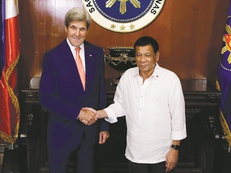 Philippine President Rodrigo Duterte welcomes US Secretary of State John Kerry during his visit at the Malacanang Palace yesterday.