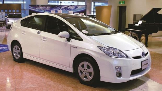 A Toyota Prius on display at a showroom in Tokyo. Despite introducing a new-look sedan model featuring improved mileage and a higher-tech interior, US deliveries of Toyotau2019s Prius hybrid plunged 25% in the first half of the year.