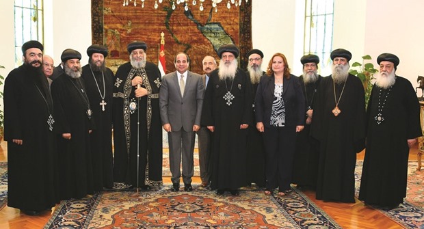 Egyptian President Abdel Fattah al-Sisi attends a meeting with Egyptian Coptic Pope Tawadros II and members of the Holy Synod of the Coptic Orthodox Church at the Ittihadiya presidential palace in Cairo yesterday.