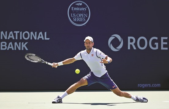 Novak Djokovic of Serbia plays a shot against Gilles Muller of Luxembourg on Day Three of the Rogers Cup in Toronto on Wednesday. (AFP)