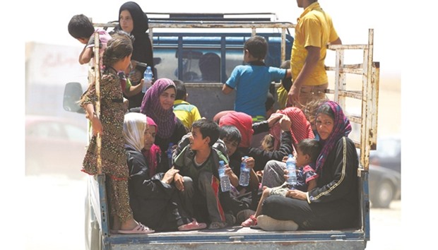 A group of Iraqi women and children fleeing the towns of al-Shirqat and Qayyarah during fighting between Iraqi government forces and militants of the Islamic State group. A large number of children throughout the world are struggling to hold on to life fraught with dangers and hardships. They become the target of bombs in the ongoing wars and conflicts in the Middle East.