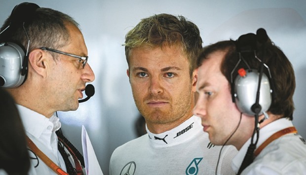 Mercedes driver Nico Rosberg gets ready in the garage for the second practice session for the German Grand Prix at the Hockenheim circuit yesterday.