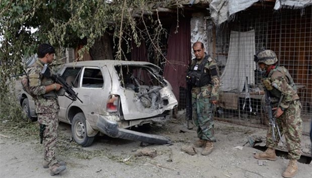 Afghan soldiers inspect a destroyed vehicle after an operation to capture Islamic State fighters in Kot District in eastern Nangarhar province this week.