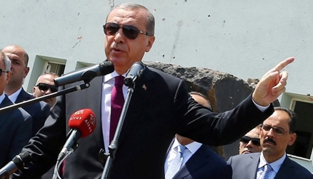 Turkey's President Tayyip Erdogan addresses the audience