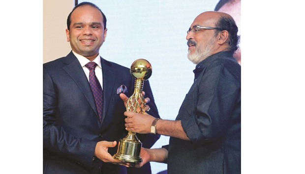 Adeeb Ahamed, managing director, LuLu Exchange Company, receiving the Global Businessman award from TM Thomas Isaac, Minister of Finance, Government of Kerala, during the 2016 Branch Icons Awards in Thiruvananthapuram on Friday.