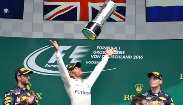 Mercedes driver Lewis Hamilton celebrates his win in the German Grand Prix at the Hockenheim circuit yesterday. (AFP)