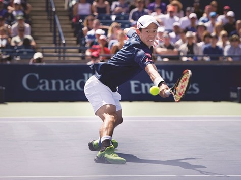 Kei Nishikori of Japan returns during his win over Stan Wawrinka of Switzerland in the semi-finals of the Rogers Cup in Toronto, Canada on Saturday. (AFP)