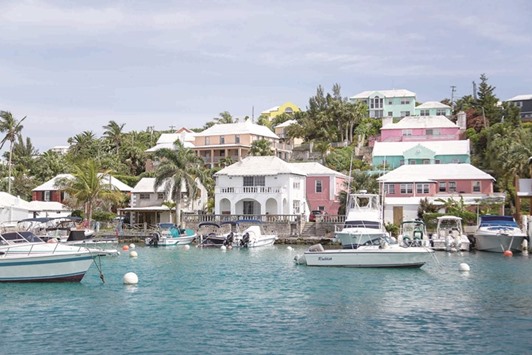 LAID BACK: Bermudau2019s Flatts Inlet, where luminous turquoise waters lap shell-pink sand beaches; frangipani perfumes the air, and pastel coloured houses snuggle behind winding hedgerow-bordered roads.