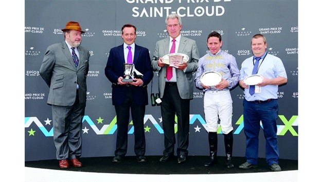 Trainer Jean-Claude Rouget and jockey Gregory Benoist with their trophies after Al Shaqab Racingu2019s Al Wathna won the Prix de Malleret (Gr2) yesterday. (Scoopdyga)