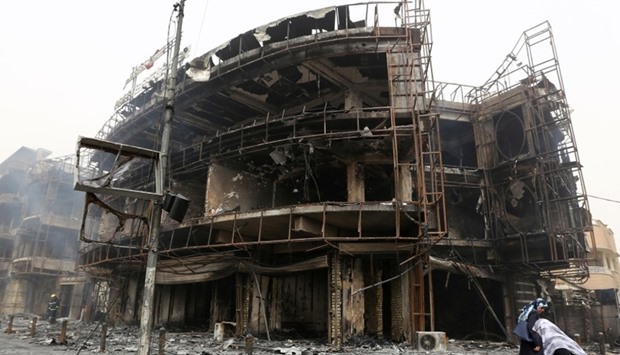 A damaged building at the site of a suicide car bombing