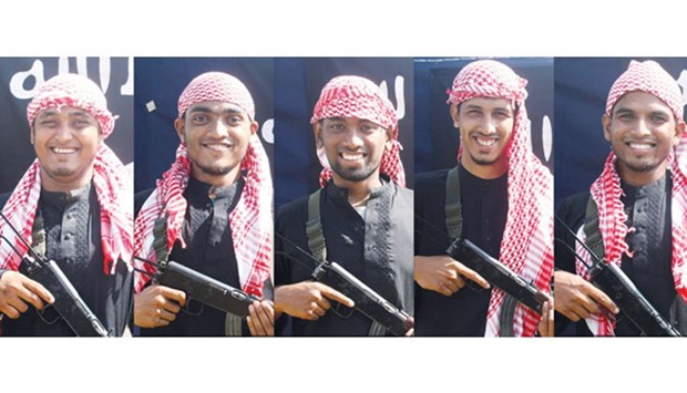 This combination of picture shows five men, allegedly the gunmen who carried out an attack in Dhaka on July 1 during which 20 hostages were slaughtered at a restaurant, posing with rifles at an undisclosed location.