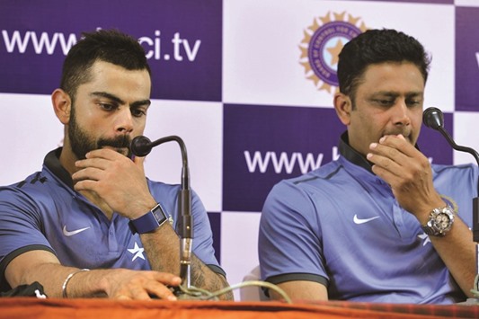Indian Test captain Virat Kohli and head coach Anil Kumble (right) take part in a press conference in Bangalore yesterday. (AFP)