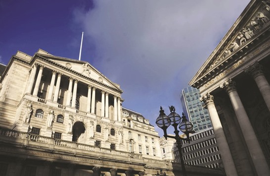 A view of the Bank of England in London. The BoE said it would lower the amount of capital banks are required to hold in reserve, freeing up an extra u00a3150bn for lending in a reversal of a decision it took earlier this year.
