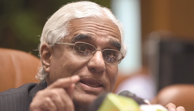 Indrajit Coomaraswamy addressing reporters at the Central Bank in Colombo yesterday.