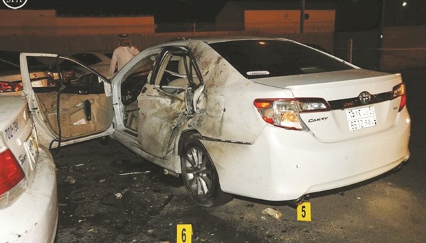 A damaged car is seen after a blast near the US consulate in Jeddah.