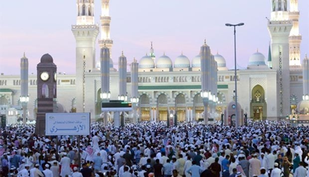 Worshippers gather at the Prophet Muhammad mosque for Eid al-Fitr prayers in Medina on Wednesday, marking the end of the holy month of Ramadan.