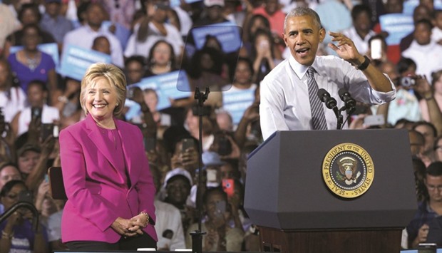 US President Obama and Democratic presidential candidate Clinton attending a campaign event in Charlotte, North Carolina.