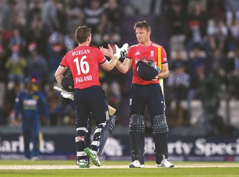 Eoin Morgan and Jos Buttler celebrate after guiding England to eight-wicket win over Sri Lanka in the Twenty20 match at Southampton. (Reuters)
