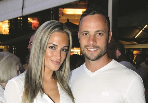 This file photo shows Oscar Pistorius posing next to his girlfriend Reeva Steenkamp at Melrose Arch in Johannesburg.